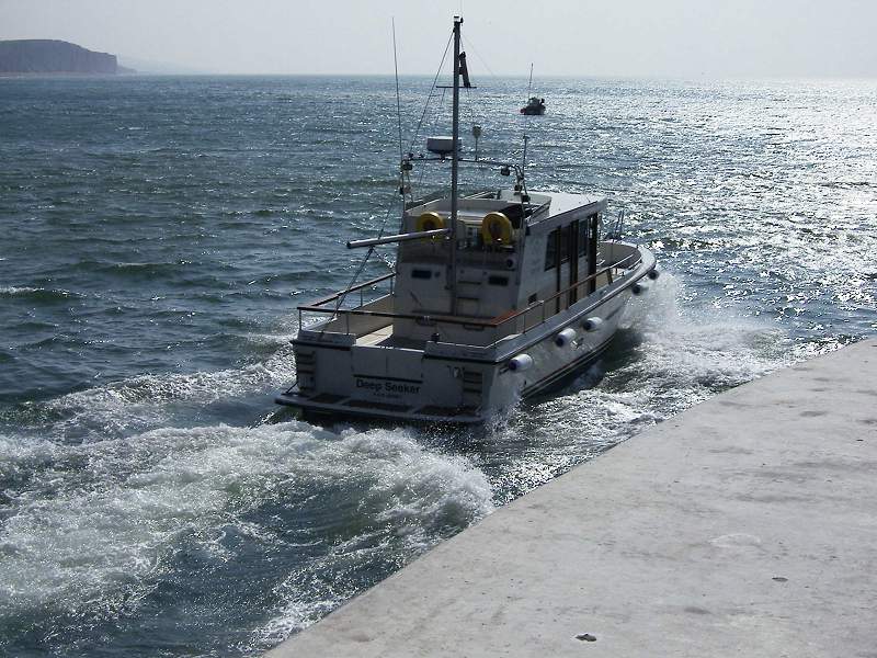 West Bay, Boat leaving the Harbour
